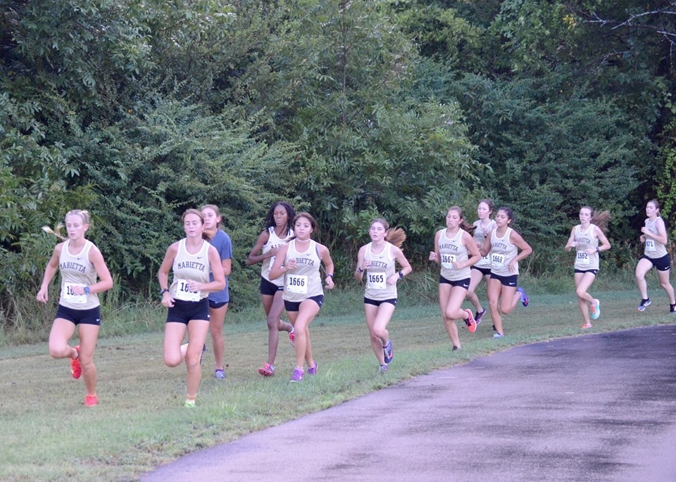 The Marietta Lady Indians’ Cross Country team was captured in a photograph warming up for their meet on August 24. The Lady Indians team, led by seniors Mandy Sykora and Kaelyn Dobbins, won the meet. The boys’ team finished in third place.