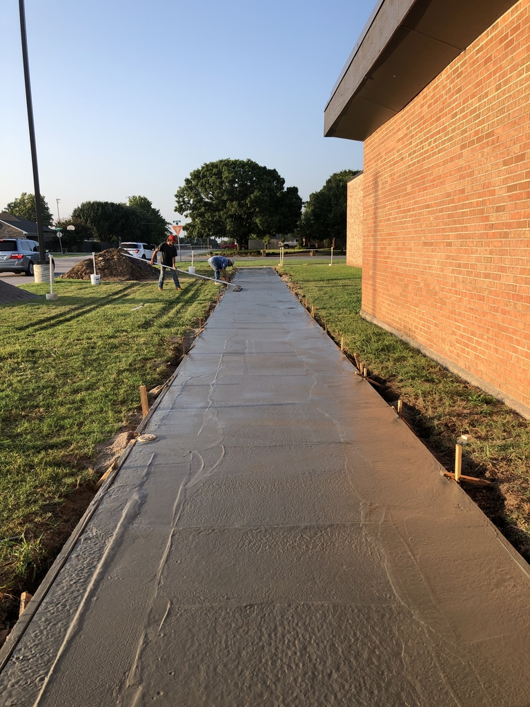 Sidewalk was poured today on the east side of the Middle School.  The west side will be poured next. Good things happening at Marietta Middle School!!